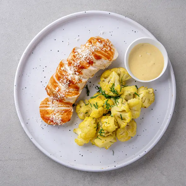 Baked Feta & Caper-stuffed Chicken with Turmeric Cauliflower & Lemon Sauce